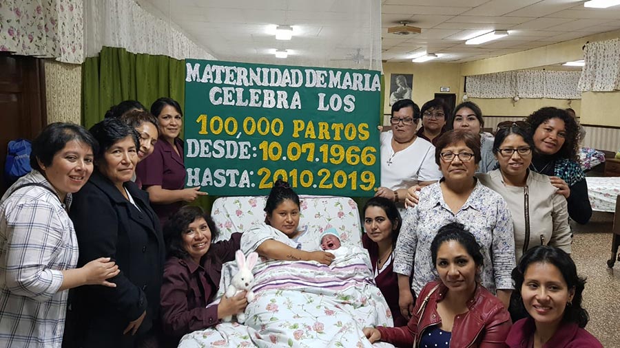 100000th baby with Mother and Staff