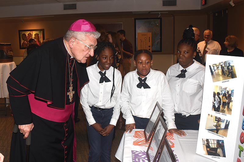 Bishop Zubik talking with students