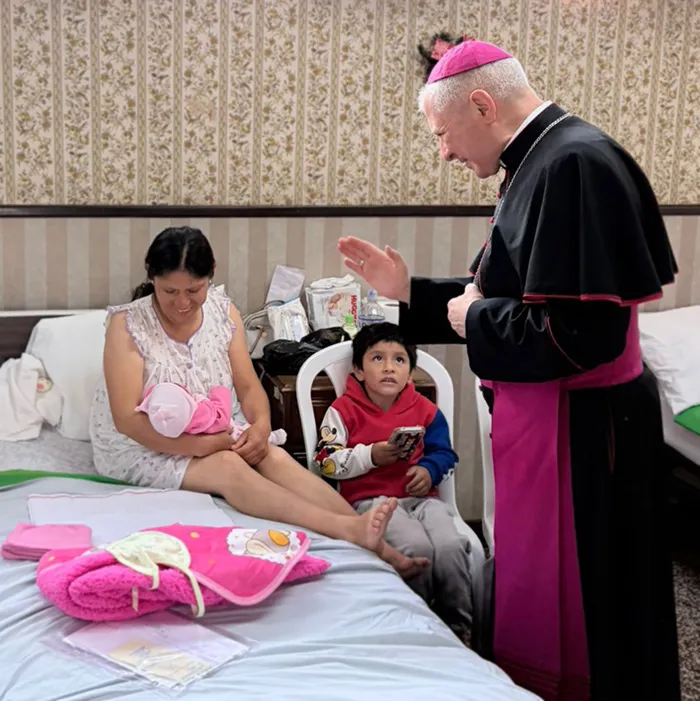 The Apostolic Nuncio prays for a mother and newborn