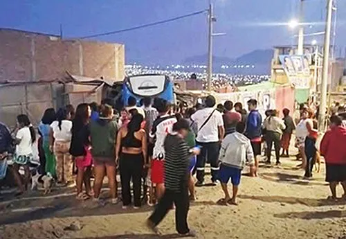 Bus crash scene with gathering crowd