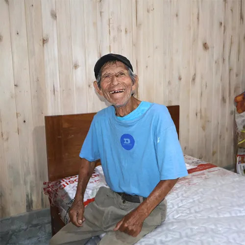 Ermenegildo smiling in his new home