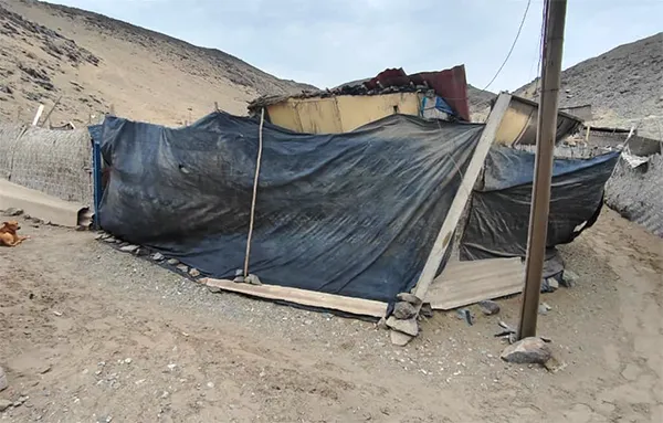 Barrio covered with plastic sheeting