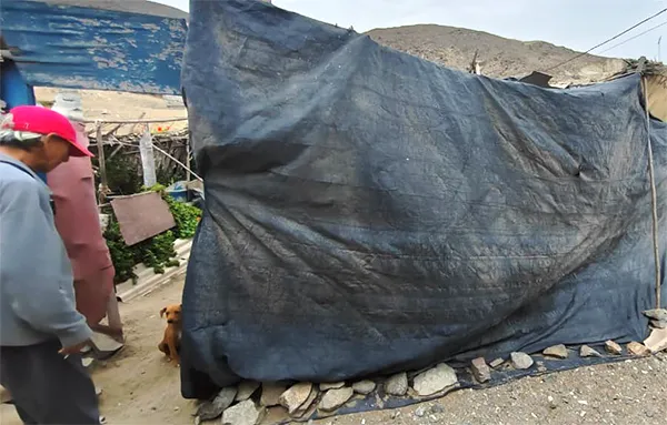 Barrio covered with plastic sheeting