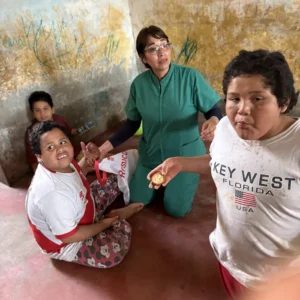 Three young boys receiving care form Ellie